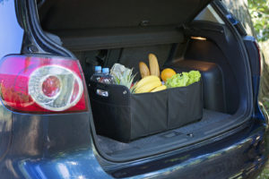 car trunk organizer filled with groceries