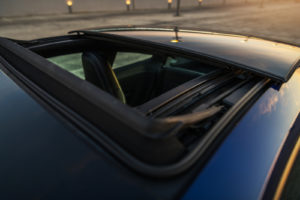 Blue Car With an opened panoramic sunroof