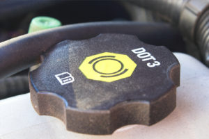 close up of the brake fluid reservoir cap in a car