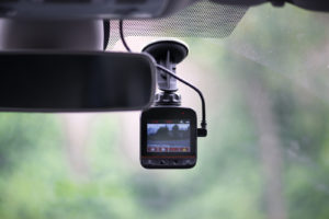Dash camera in car installed on the window