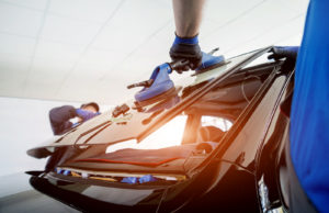 Body Shop Technicians Replacing Car Windscreen