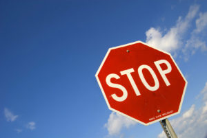 Stop sign with a blue sky background