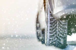 Close-up Of a Car's rear Wheels In Deep Winter Snow