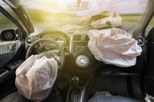 Image an interior of a car that just got into a car accident with airbags deployed